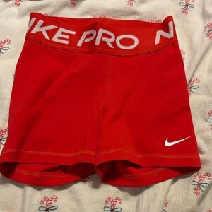 Nike Red Youth Compression Shorts with White Swoosh